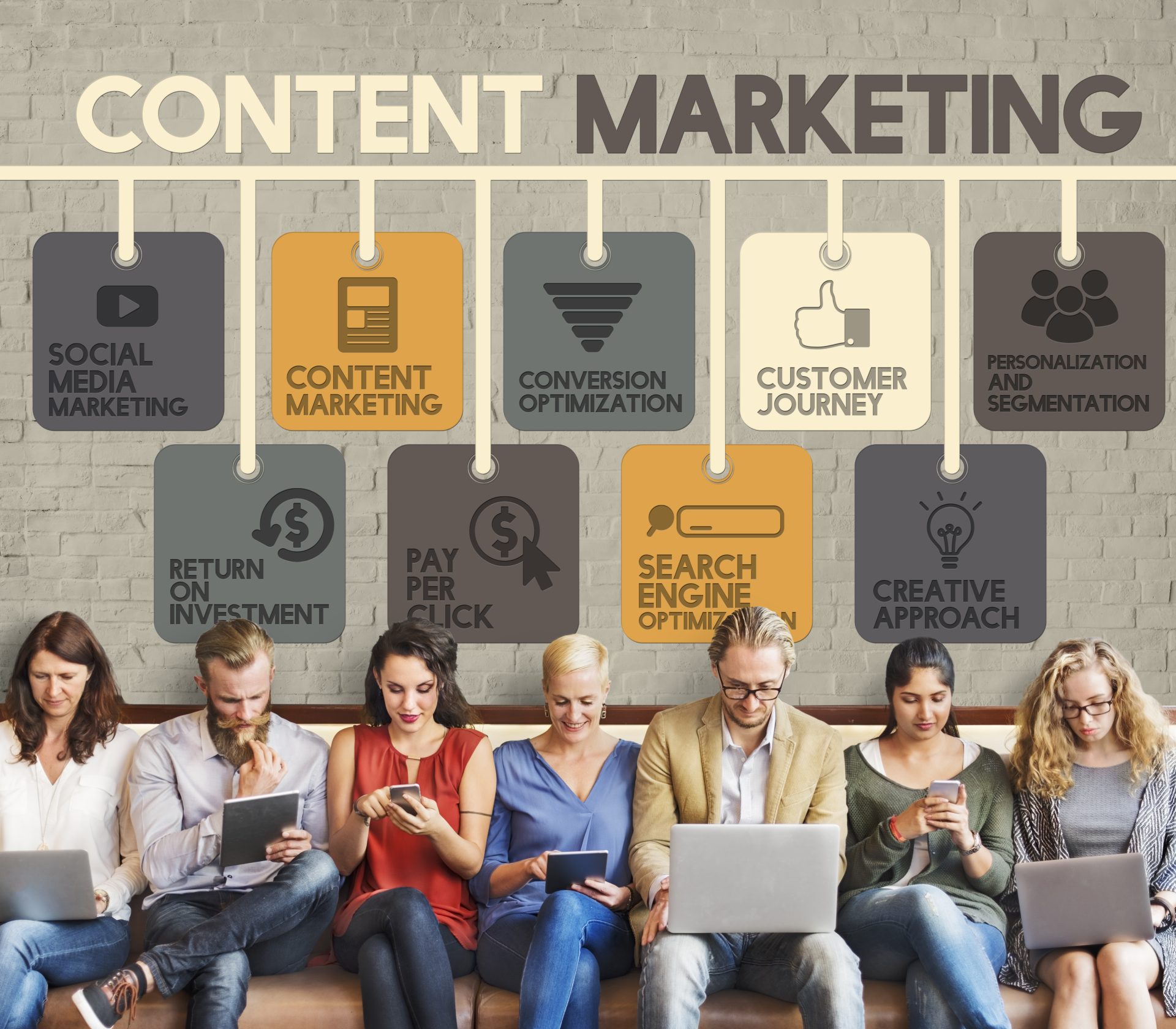 people sit with devices and Content Marketing