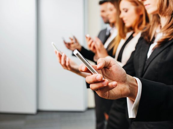 Business people using smartphone