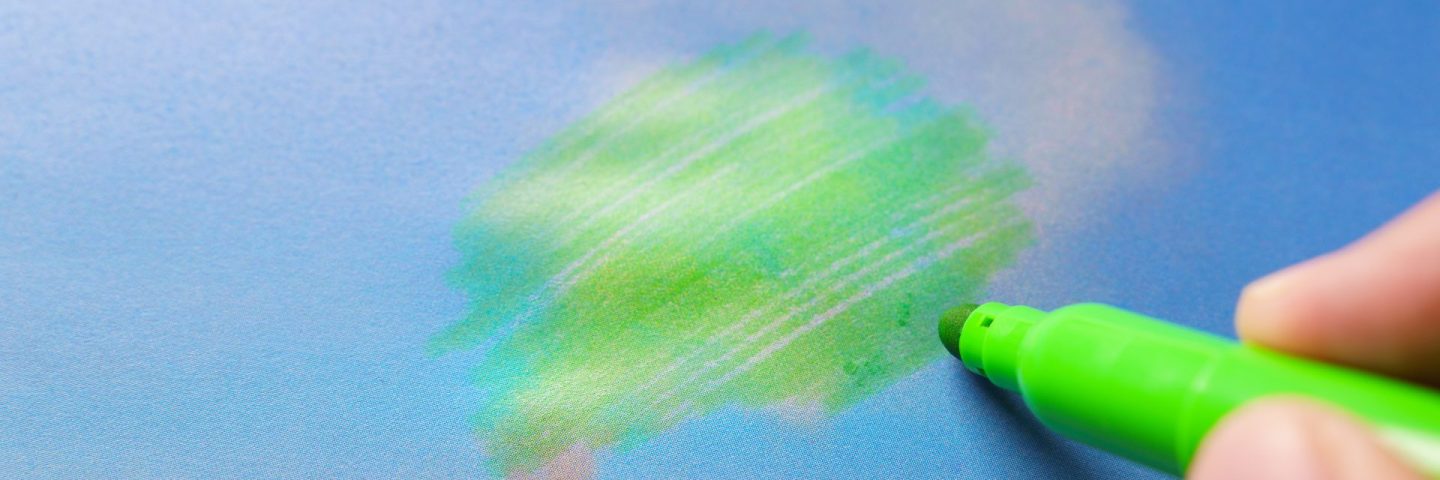 Man painting green pollution from a chimney