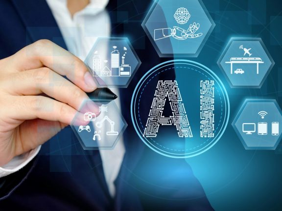 Businessman showing Artificial intelligence concept with related icon