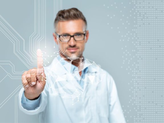 selective focus of handsome scientist touching brain interface in air isolated on white, artificial intelligence concept