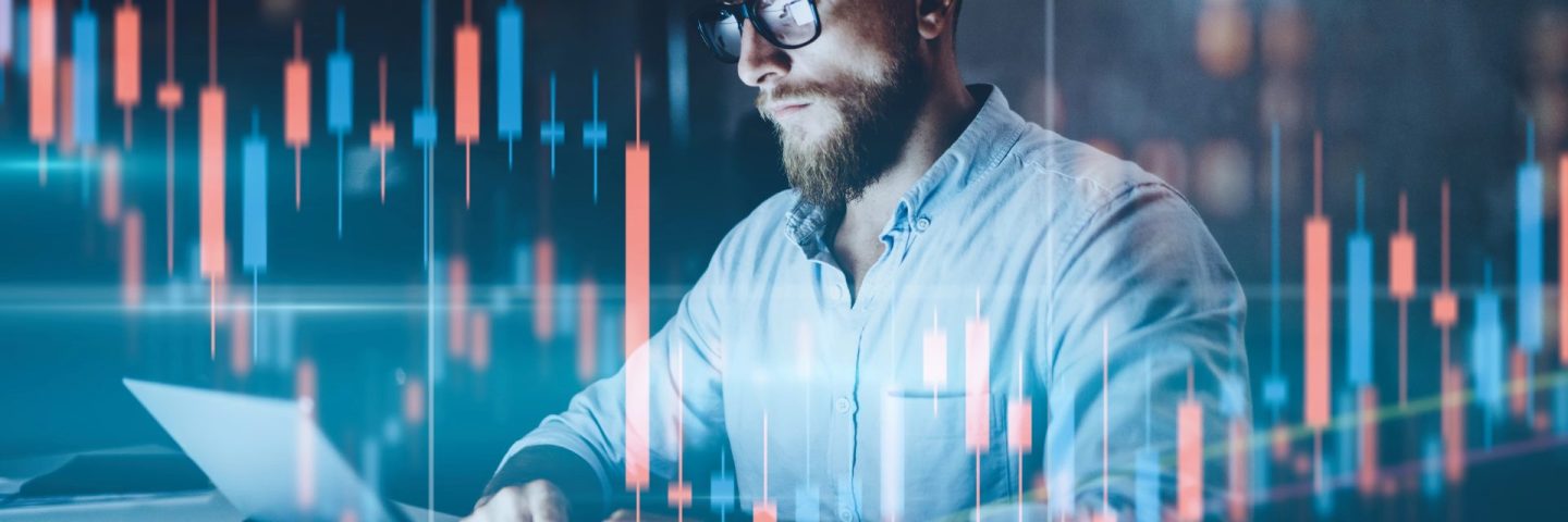 Double exposure.Market traider making analysis of digital market and investment in block chain crypto currency. Red and green candlestick chart and stock trading computer screen background.