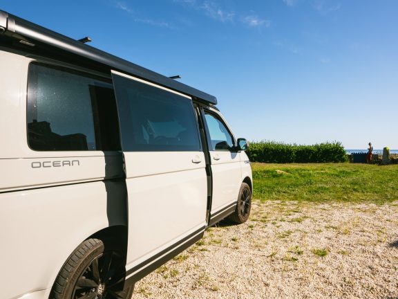 Bretagne, France - July 12 2022: The new 2021 Volkswagen VW Transporter Camping Van T6.1 California Ocean in the coastal Nature