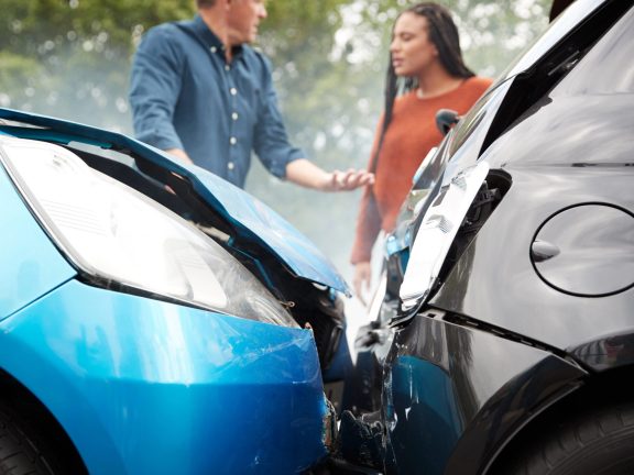 Two Angry Motorists Arguing Over Responsibility For Car Accident