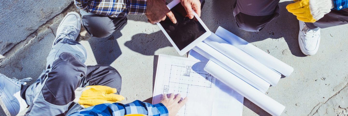 construction workers discussing building plans