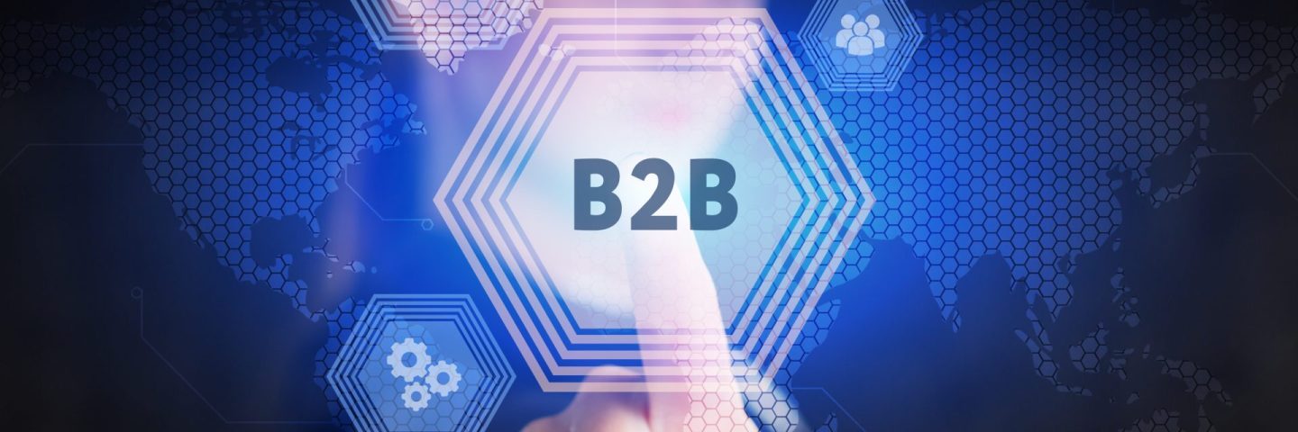 Business, Technology, Internet and network concept. Young businessman working on a virtual screen of the future and sees the inscription: B2B
