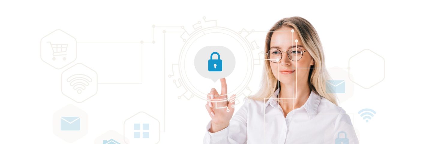 portrait of smiling businesswoman in formal wear pointing at cyber security sign isolated on white