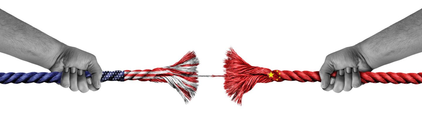 China US Diplomatic Crisis concept as a Broken Rope representing decoupling as a metaphor for economic trade war and political relationship between Beijing and Washington due to Tariffs and geopolitical disputes.