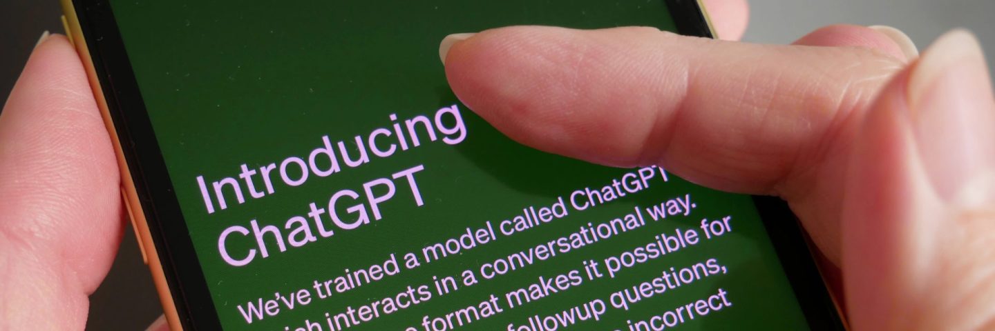 Lviv, Ukraine - 03 11 2023: OpenAI To Offer Commercial Version Of ChatGPT, smartphone display with Chat GPT login screen on the background. A new AI chatbot by OpenAI.