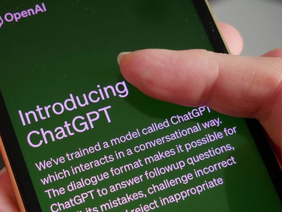 Lviv, Ukraine - 03 11 2023: OpenAI To Offer Commercial Version Of ChatGPT, smartphone display with Chat GPT login screen on the background. A new AI chatbot by OpenAI.