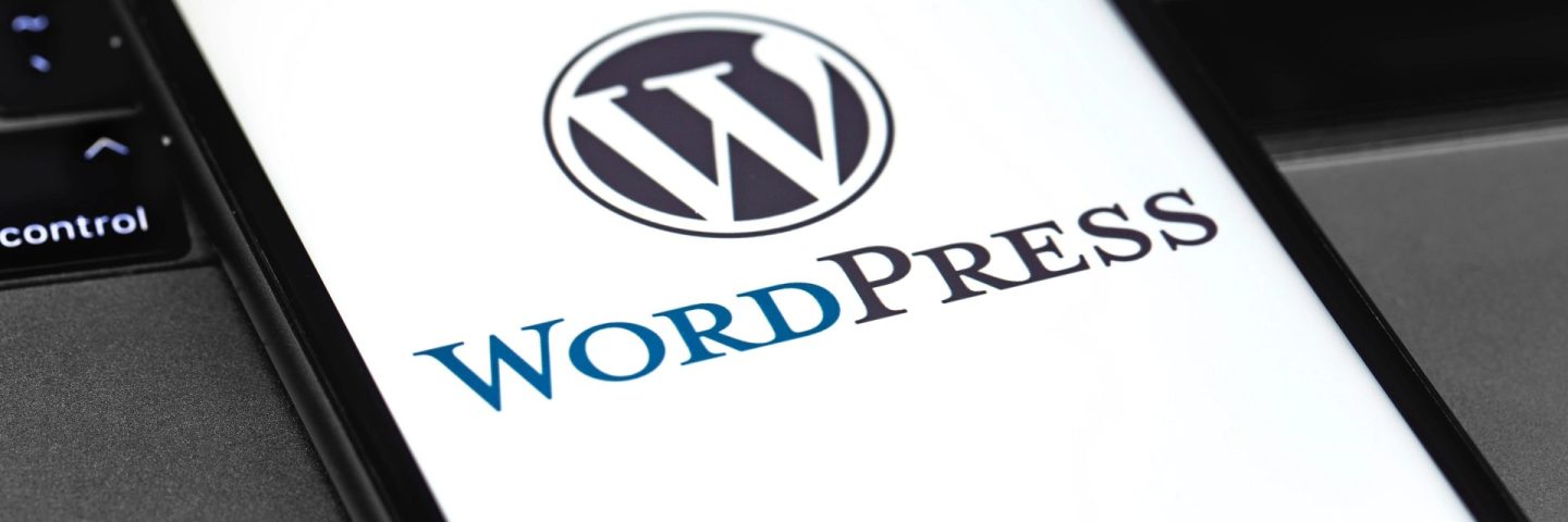 WordPress logo on the display smartphone and notebook closeup. WordPress - open source site content management system. Moscow, Russia - June 24, 2020