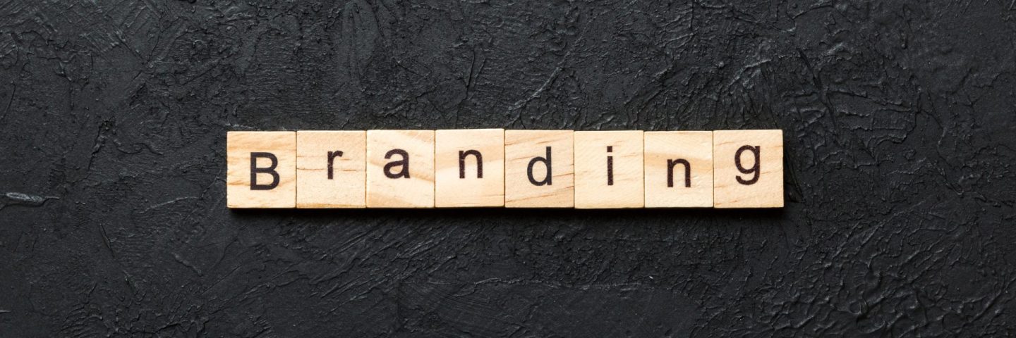 branding word written on wood block. branding text on table, concept.