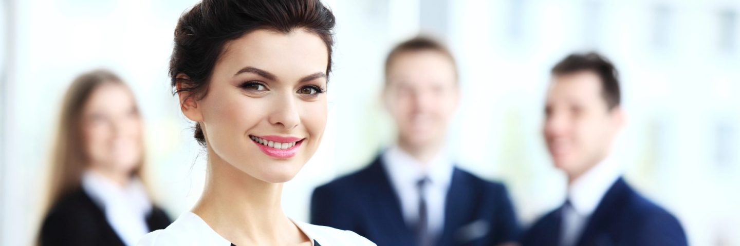 Face of beautiful woman on the background of business people