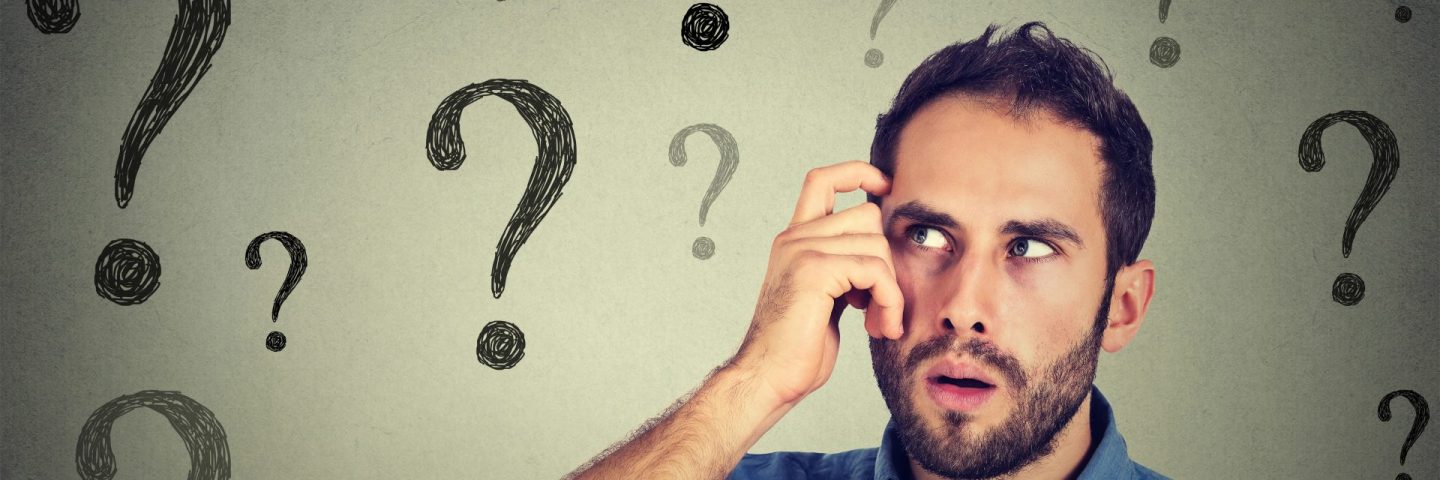 Thoughtful confused handsome man has too many questions and no answer