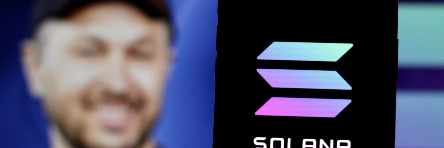 In this Photo Solana Cryptocurrency logo is displayed on a smartphone screen With CEO Anatoly Yakovenko in the background.indonesia-may 17th 2024.
