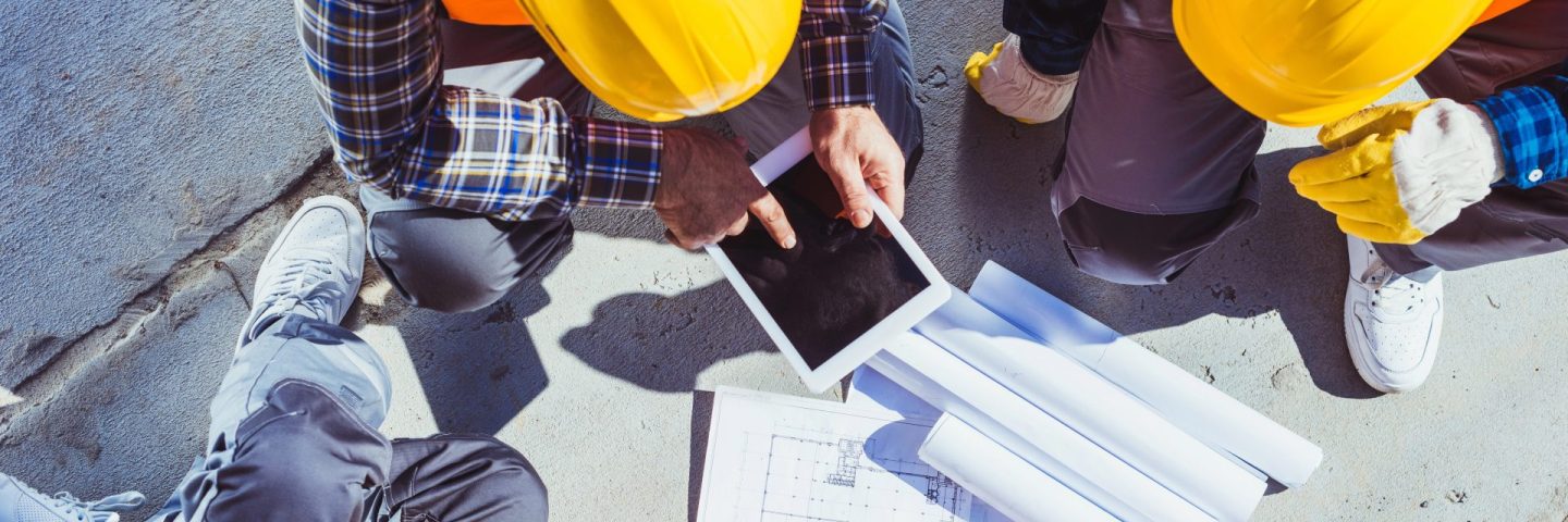 construction workers discussing building plans