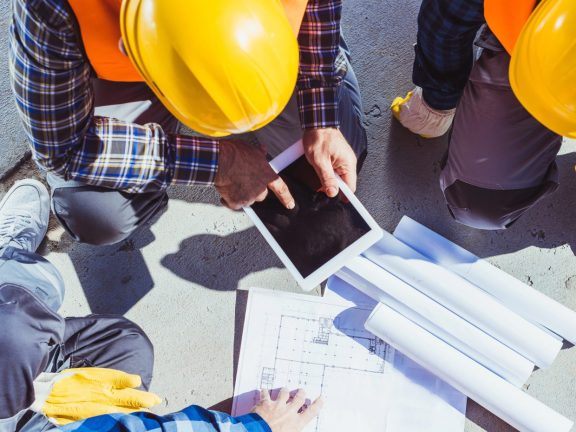 construction workers discussing building plans