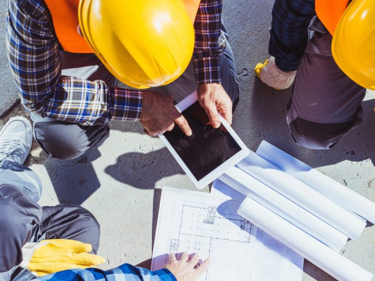 construction workers discussing building plans