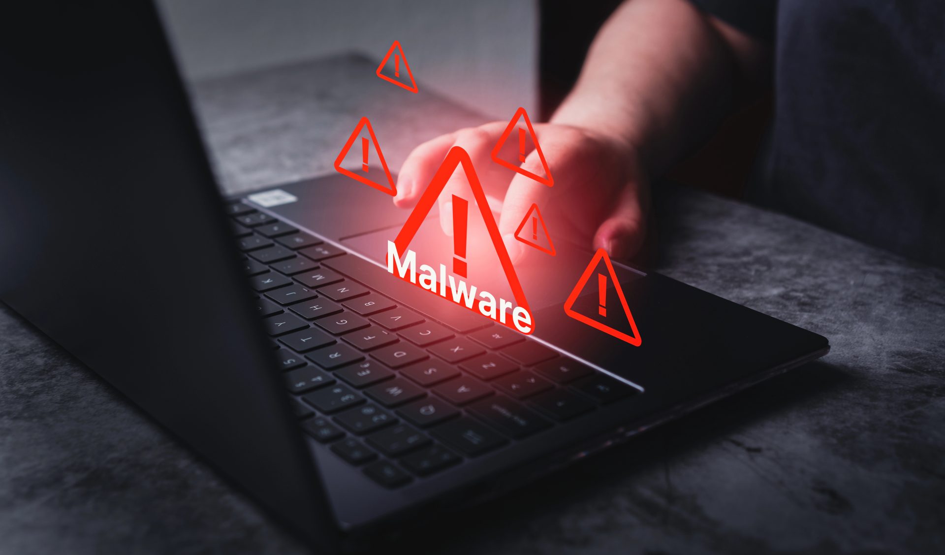 System hacked warning alert on laptop. Virus, Spyware, Malware or Malicious software. Woman receives warning notification on laptop.