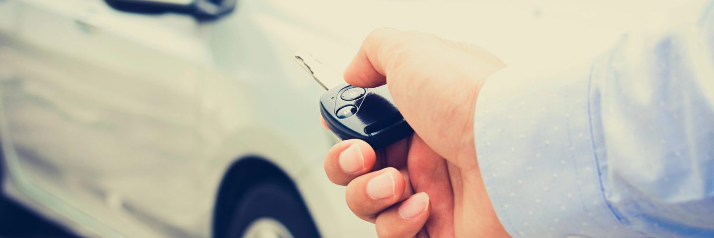 Hand pressing remote control car key