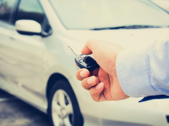 Hand pressing remote control car key