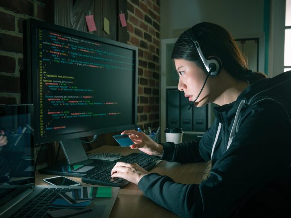 beauty attractive hacker woman wearing headphone