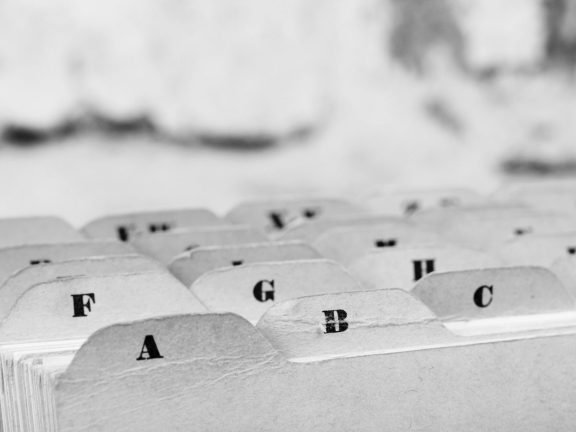 Close up of alphabetical index cards in box