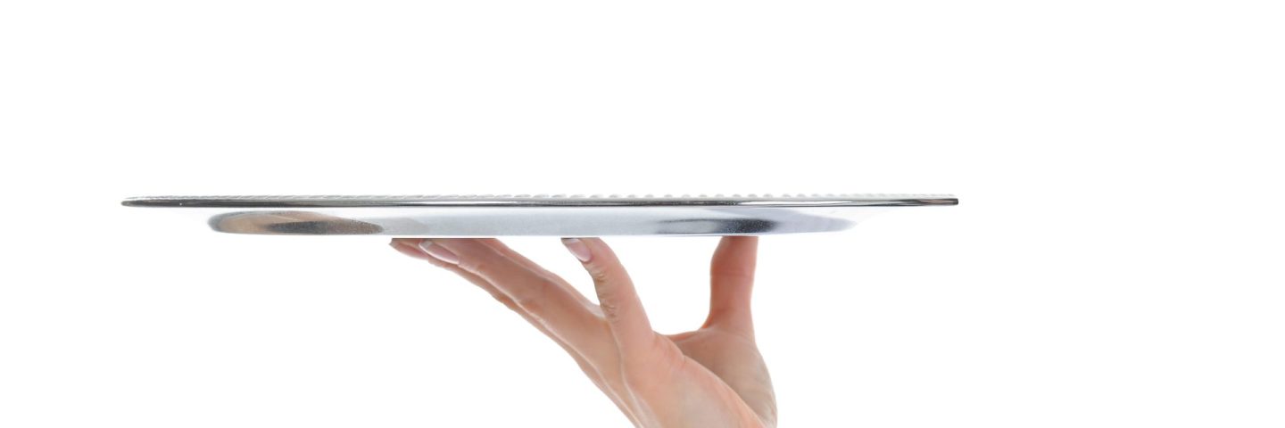 Waiter holding empty silver tray