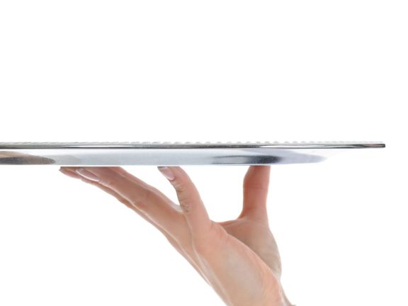 Waiter holding empty silver tray
