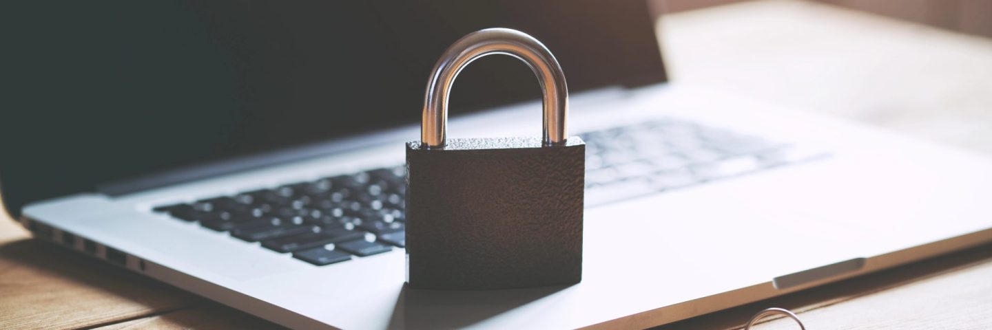 Lock on laptop as computer protection and cyber safety concept. Private data protection from hacker malware