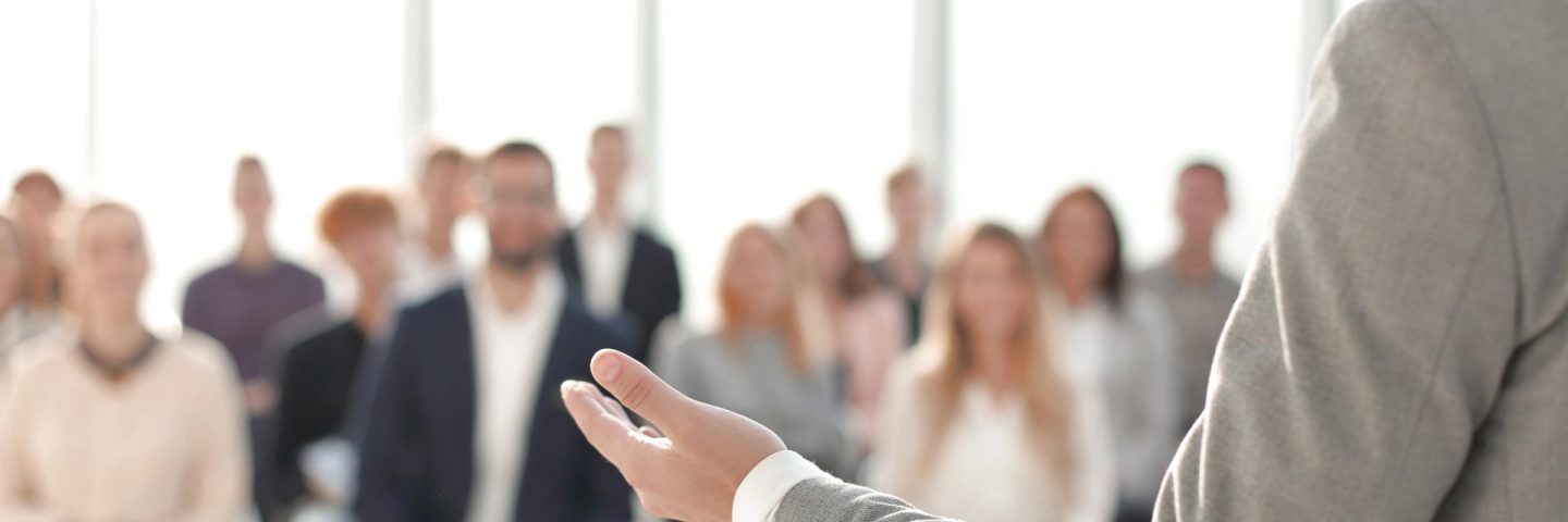 image of a speaker giving a lecture at a business seminar