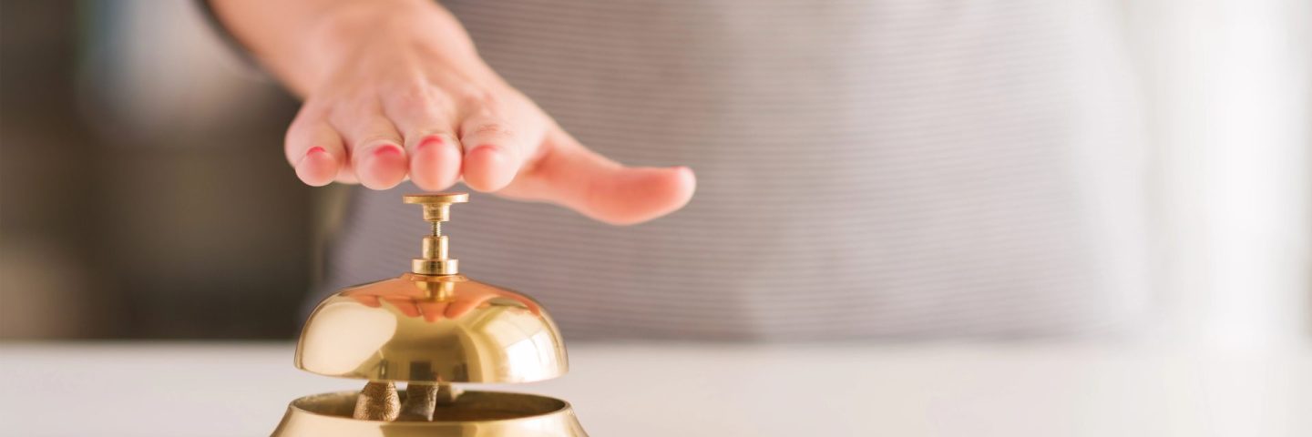 Woman Ringing Service Bell
