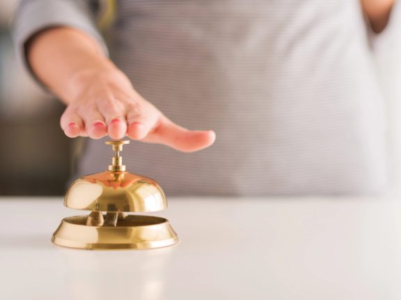 Woman Ringing Service Bell