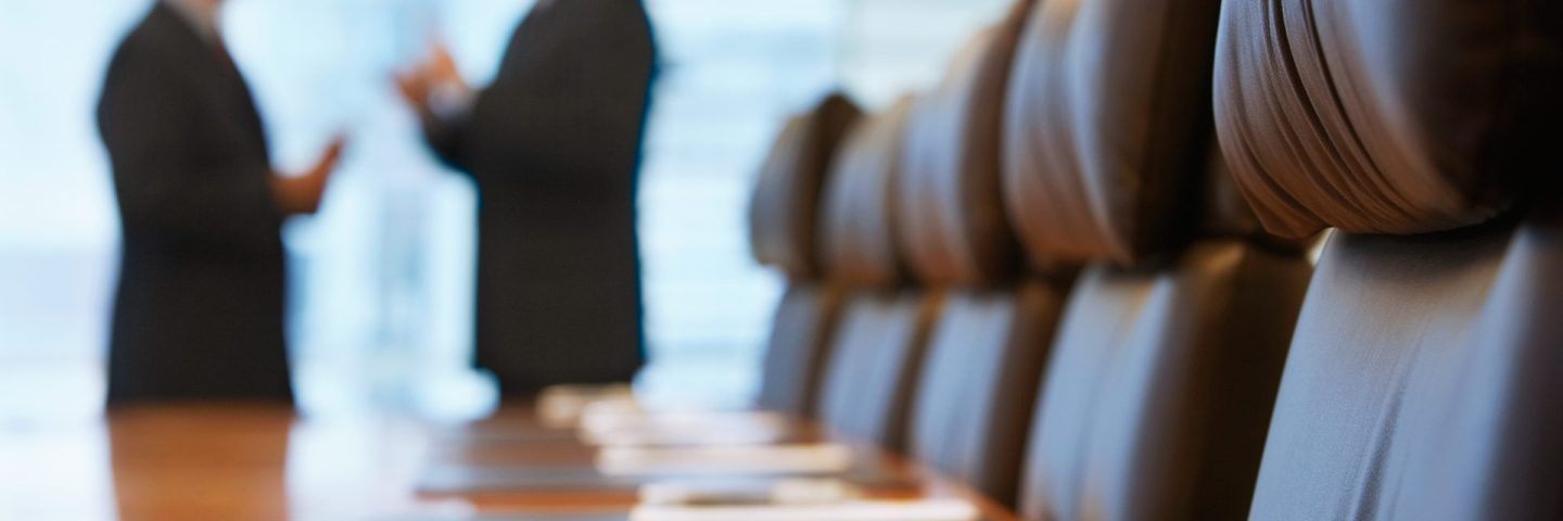 Businessmen talking in conference room
