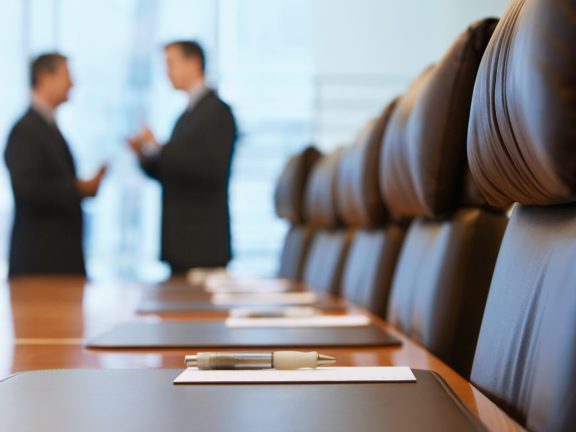 Businessmen talking in conference room