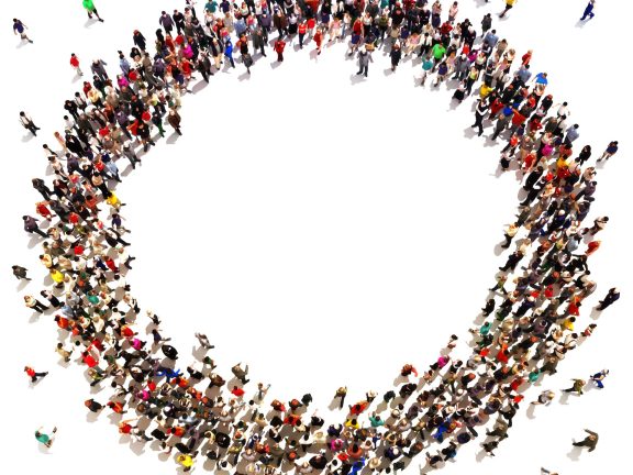Large crowd of people moving toward the center forming a circle with room for text or copy space advertisement on a white background.