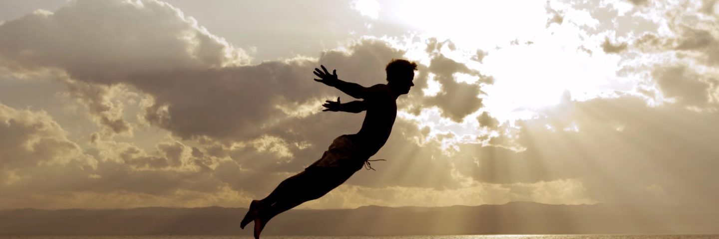 One person acrobatic jumping scene symbolize vitality, aspiration, success, progress