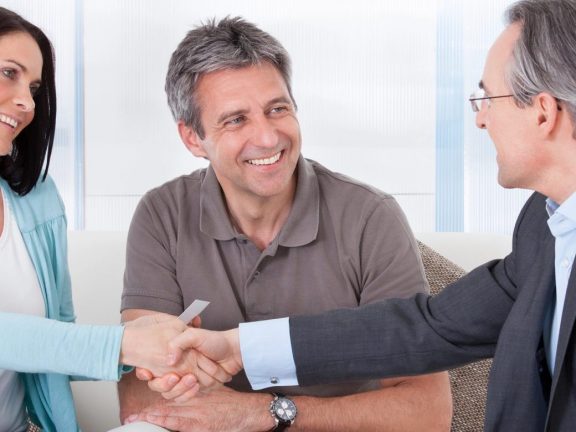 Consultant Shaking Hand With Woman