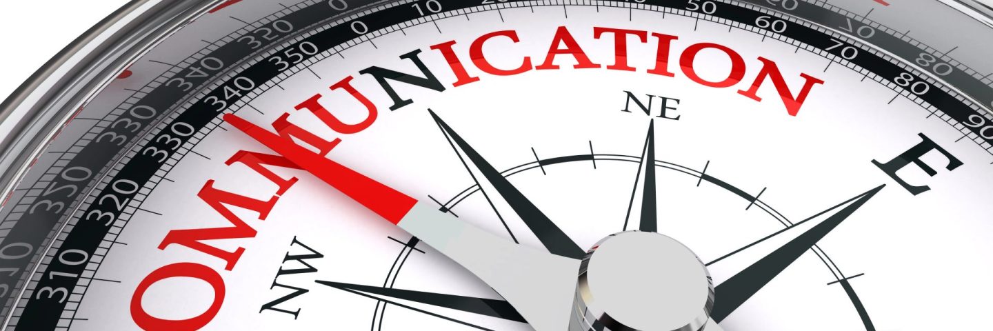 communication red word on conceptual compass