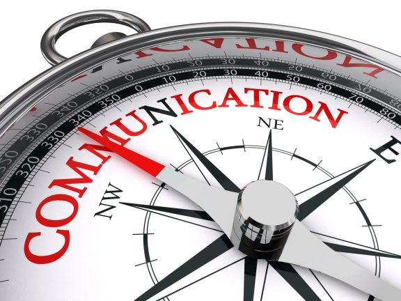 communication red word on conceptual compass