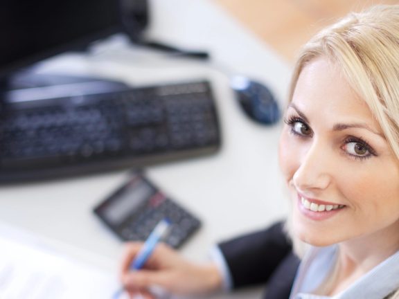 Beautiful businesswoman doing finances