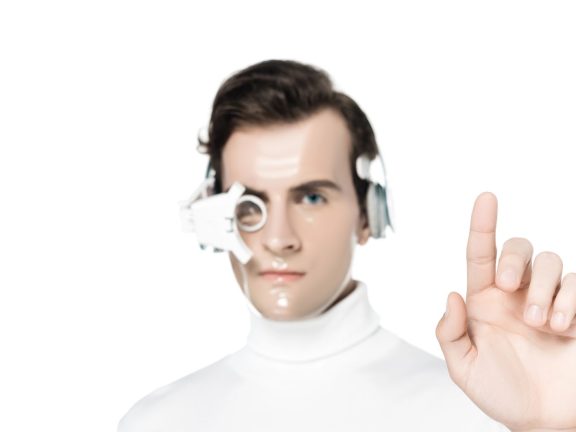 Cyborg in digital eye lens and headphones on blurred background pointing with finger isolated on white