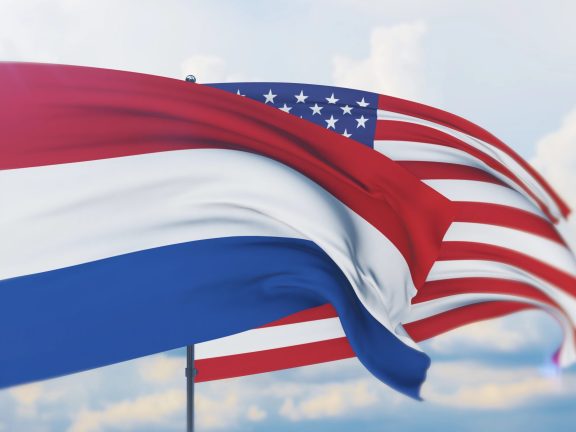 Waving American flag and flag of Netherlands. Closeup view, 3D illustration.