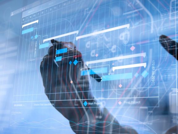 Project manager working and update tasks with milestones progress planning and Gantt chart scheduling virtual diagram.Businessman hand pressing an imaginary button on virtual screen