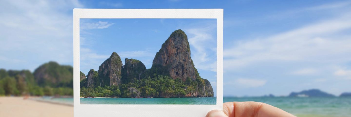 Hand With Photo of Beach