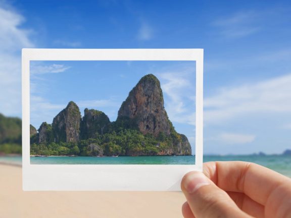 Hand With Photo of Beach