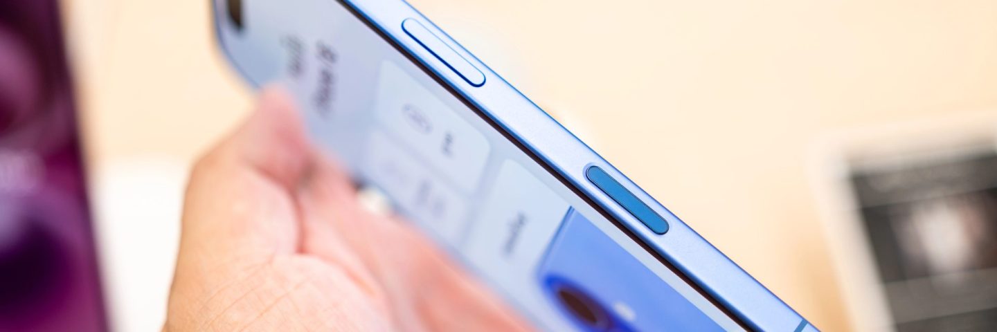 Bangkok Thailand SEP 20 2024: Apple launch new smartphone iPhone 16 displayed in a Store. Hand holding iPhone 16 Ultramarine and showing the new Camera Control button.