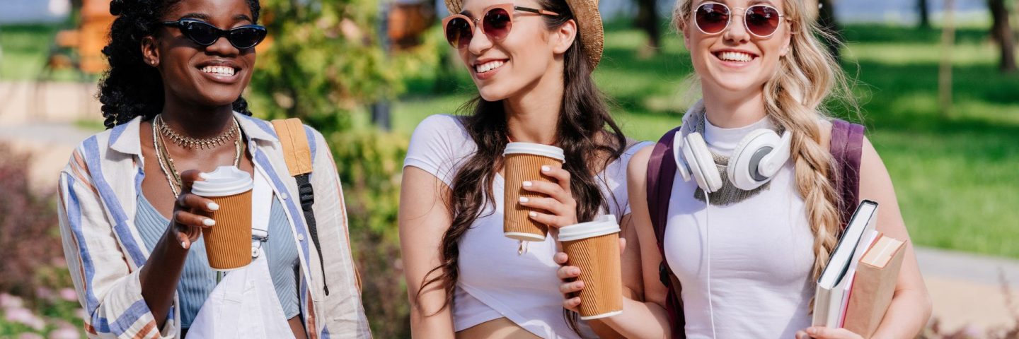 multicultural women walking in park