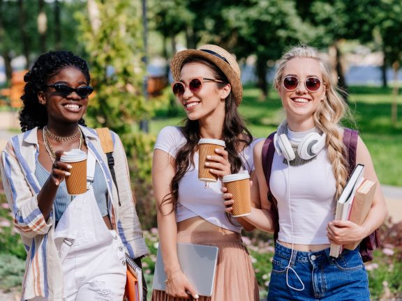 multicultural women walking in park