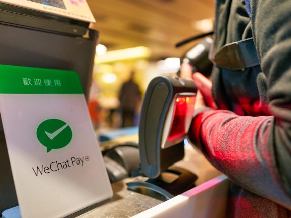 HONG KONG, CHINA - CIRCA JANUARY, 2019: close up shot of WeChat Pay payment services sign seen at Cafe De Coral in Hong Kong. WeChat Pay digital wallet service incorporated into WeChat.